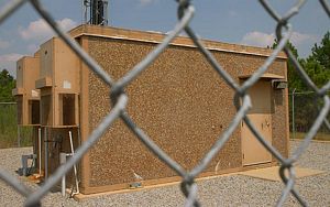 jpeg thumbnail of U.S. Cellular brown, exposed aggregate finished shelter w/door on side
